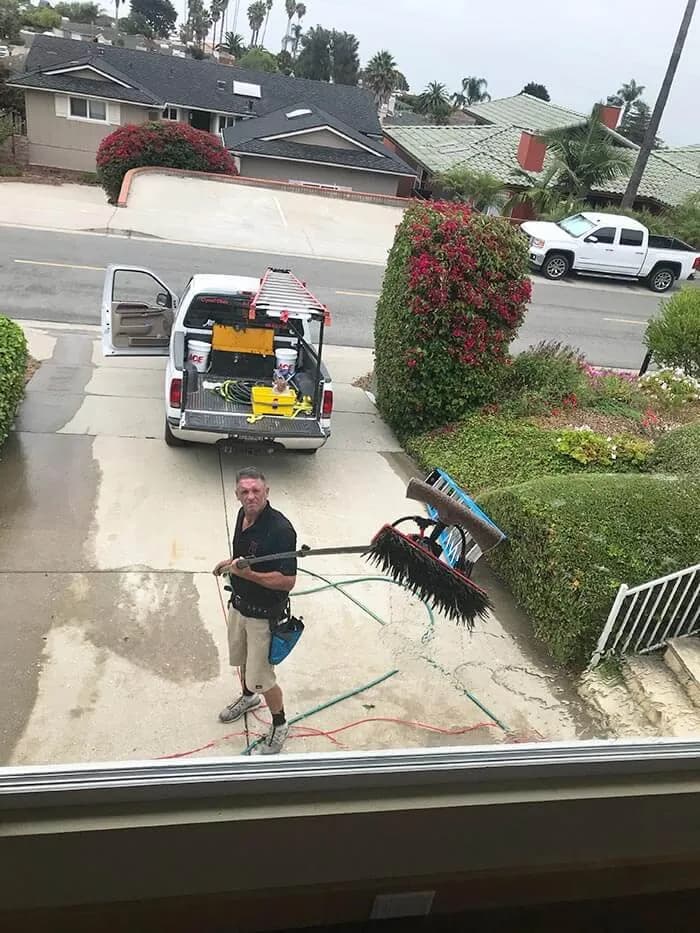 The Crystal Clean A1 work truck loaded with equipment in a residential driveway