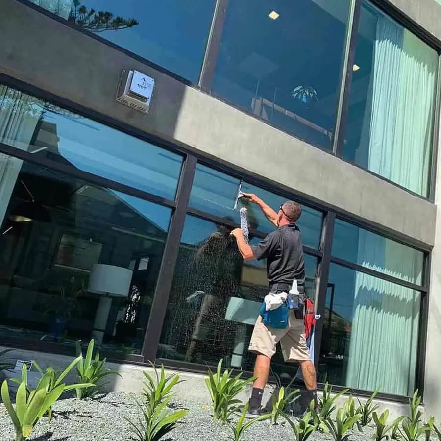 Crystal Clean A1 cleaning the exterior glass of a commercial building in San Luis Obispo County